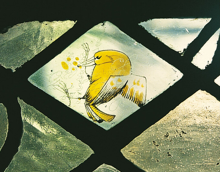 Detail of the stained glass window in the Chapter House. Some fragments of medieval stained glass still exist in Durham Cathedral and have been incorporated into later windows. This is one such example. 