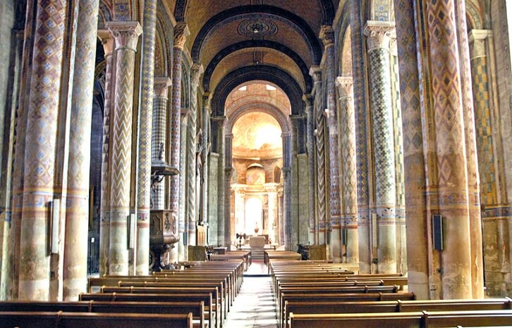 The nave of Notre Dame la Grande, Poitiers, France, 12th century. It is often difficult to imagine that the interior of Romanesque churches would have originally been quite colourful. The geometric designs still seen at Poitiers, however, give us a good sense of what Durham Cathedral and the Norman Chapel at Durham Castle would have looked like.