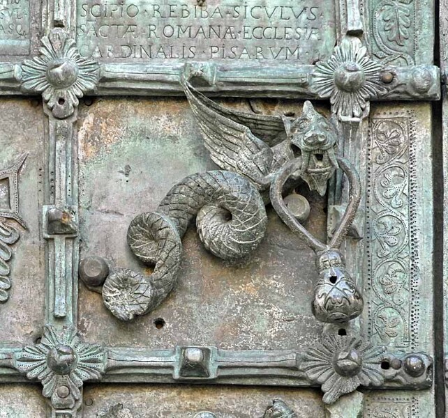 Troia Cathedral Doorknocker. Part of an elaborate bronze door made in 1119, Troia Cathedral, Italy. Unlike the Sanctuary Knocker at Durham Cathedral, the dragon here looks almost friendly. In terms of their concept though, the two knockers have something in common. 