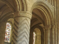 The geometric designs carved in the stone pillars of Durham Cathedral were common in Norman architecture. The specific details of these suggest that the masons who carved them also worked on Lindisfarne Priory to the North of Durham. 