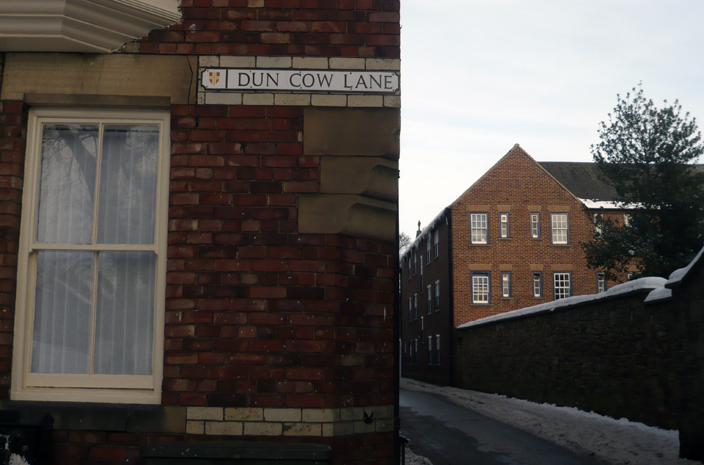 The chamfered corner on Dun Cow Lane. Chamfered corners were a clever technique of preventing a corner building from getting in the way of traffic.