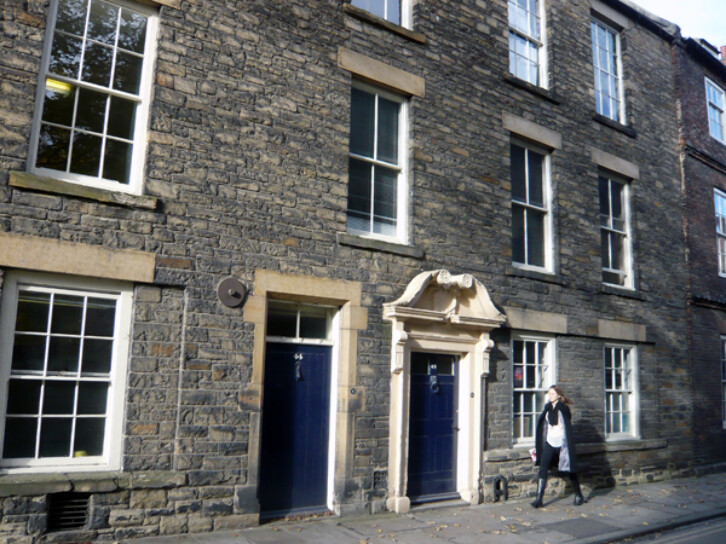 A nineteenth-century remodelling of the facade of a 17th century building on North Bailey. Often, the remodelling of facades was done simply to make buildings look fashionable. The elaborate doorway on the right is the original 17th century one, however. 