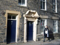 A nineteenth-century remodelling of the facade of a 17th century building on North Bailey. Often, the remodelling of facades was done simply to make buildings look fashionable. The elaborate doorway on the right is the original 17th century one, however. 