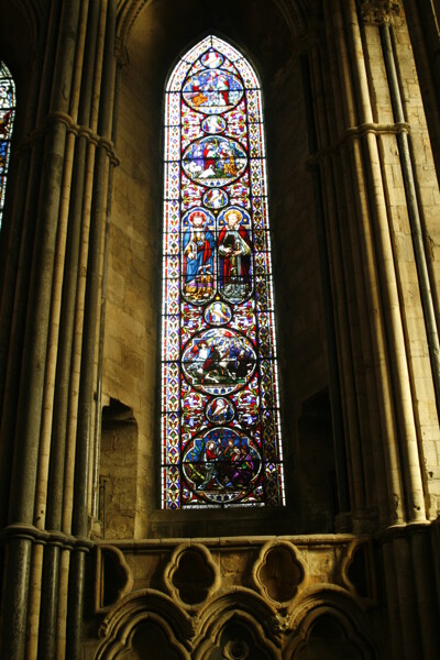 Peter and Paul Window. Inaugurated in 1865, this window is the work of Clayton and Bell of Bristol. It is located in the 13th century chapel of the nine altars, designed, as per the gothic tradition, as an expanse of coloured glass, depicting religious scenes.