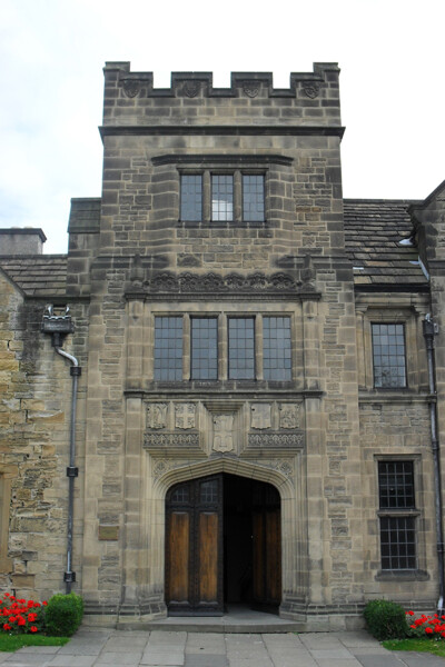 The Pemberton Building shows a Tudor influence. Here, this is seen in the rows of small leaded windows and the shape of the doorway.