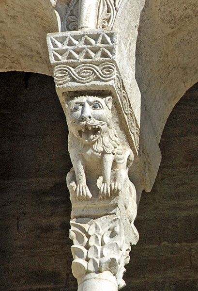 Carved stone lion from an arcade in Bitonto Cathedral, Italy. Mythical creatures and fearsome beasts, such as this lion, appeared frequently in Romanesque architecture.