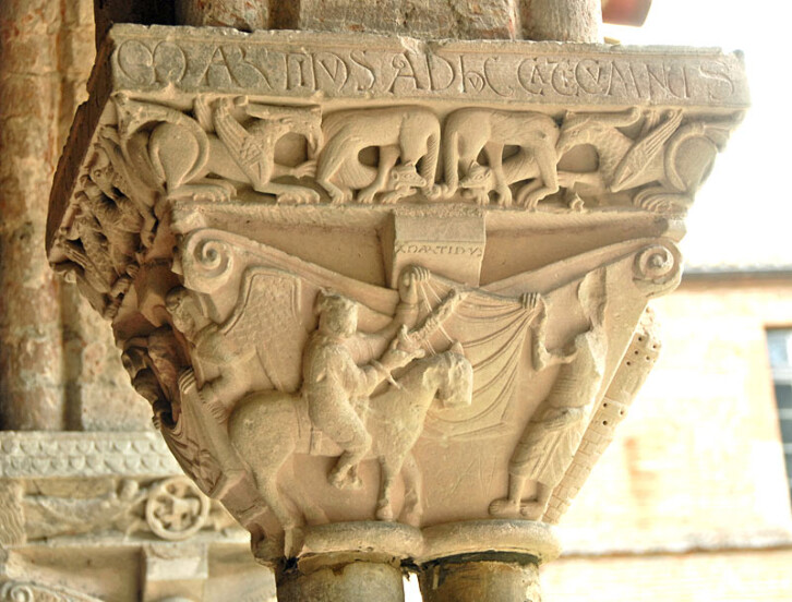 Capital depicting St Martin of Tours cutting his cloak in two to give half to a pilgrim, Abbey of St Pierre de Mossaic, France, circa 1100.
