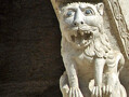 Carved stone lion from an arcade in Bitonto Cathedral, Italy. Mythical creatures and fearsome beasts, such as this lion, appeared frequently in Romanesque architecture.