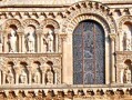 The facade of Notre Dame la Grande, Poitiers, France, 12th century. This facade is a good example of Romanesque architecture in that is very solid, makes use of rows of rounded arches in which figural sculpture is to be found, and features geometric patterns as well. 