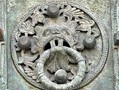 The Bronze door of Troia Cathedral was made by Oderiso di Benevento in 1119. The ringed bosses seen here may not have had the same significance as Durham Cathedral's Sanctuary Knocker, seen in the next image, but they are visually similar. 